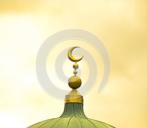 Islamic symbol on mosque cupola on yellow cloudy background photo